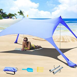 Pop-Up Strandzelt in Königsblau mit stabilen Stangen am Strand, idealer Sonnenschutz mit Lichtschutzfaktor 50, ideal für entspannende Tage im Freien.
