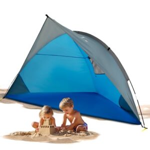 EXPLORER Reise Strandmuschel in Blau für den Strand mit UV Schutz 80+, leicht und kompakt, geeignet für bis zu vier Personen, im Einsatz mit spielenden Kindern im Sand.