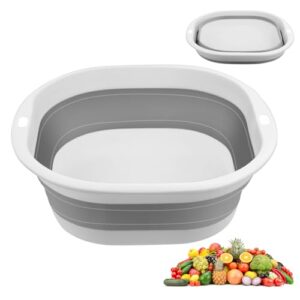 Faltbares graues Waschbecken aus Kunststoff, ideal für Camping und Küche, mit frischem Obst und Gemüse zur Verwendung in der Küche im Hintergrund.
