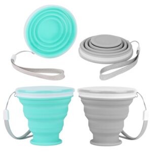Zwei faltbare Silikonbecher in mintgrün und grau mit Deckel, ideal für Camping, Reisen und Outdoor-Aktivitäten. Im zusammengeklappten Zustand nehmen sie wenig Platz ein.