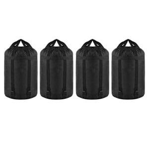 Vier schwarze Nylon Kompressionssäcke mit Zugbandverschluss, ideal für die platzsparende Aufbewahrung von Schlafsäcken und Outdoor-Ausrüstung.
