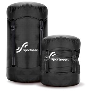 Zwei schwarze Kompressionssäcke aus wasserabweisendem Material, einer größer und der andere kleiner, ideal für Outdoor-Aktivitäten wie Camping und Wandern.