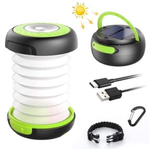 Faltbare LED Campinglampe in grün und schwarz, mit Solarzellen und USB-Ladeanschluss, ideal für Outdoor-Aktivitäten wie Camping und Angeln.