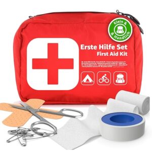 Kompaktes Mini Erste Hilfe Set Verbandskasten in rot mit weißem Kreuz, ideal für Camping, Wandern, Radfahren und Outdoor-Aktivitäten. Enthält wichtige Erste-Hilfe-Materialien wie Pflaster, Verband und Schere.