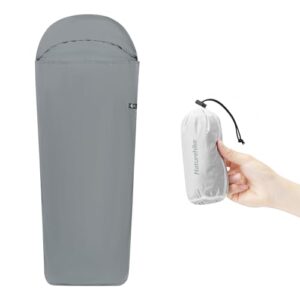 Ultraleichter Hüttenschlafsack Liner in hellgrau mit komprimierter Tragetasche, ideal für Backpacking und Camping.