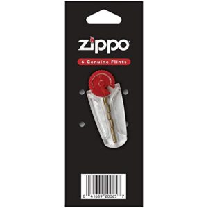 Verpackung der Zippo 2004415 Feuersteine mit 6 Stück, präsentiert in einer schwarzen Verpackung mit durchsichtigen Elementen und einem roten Drehmechanismus.